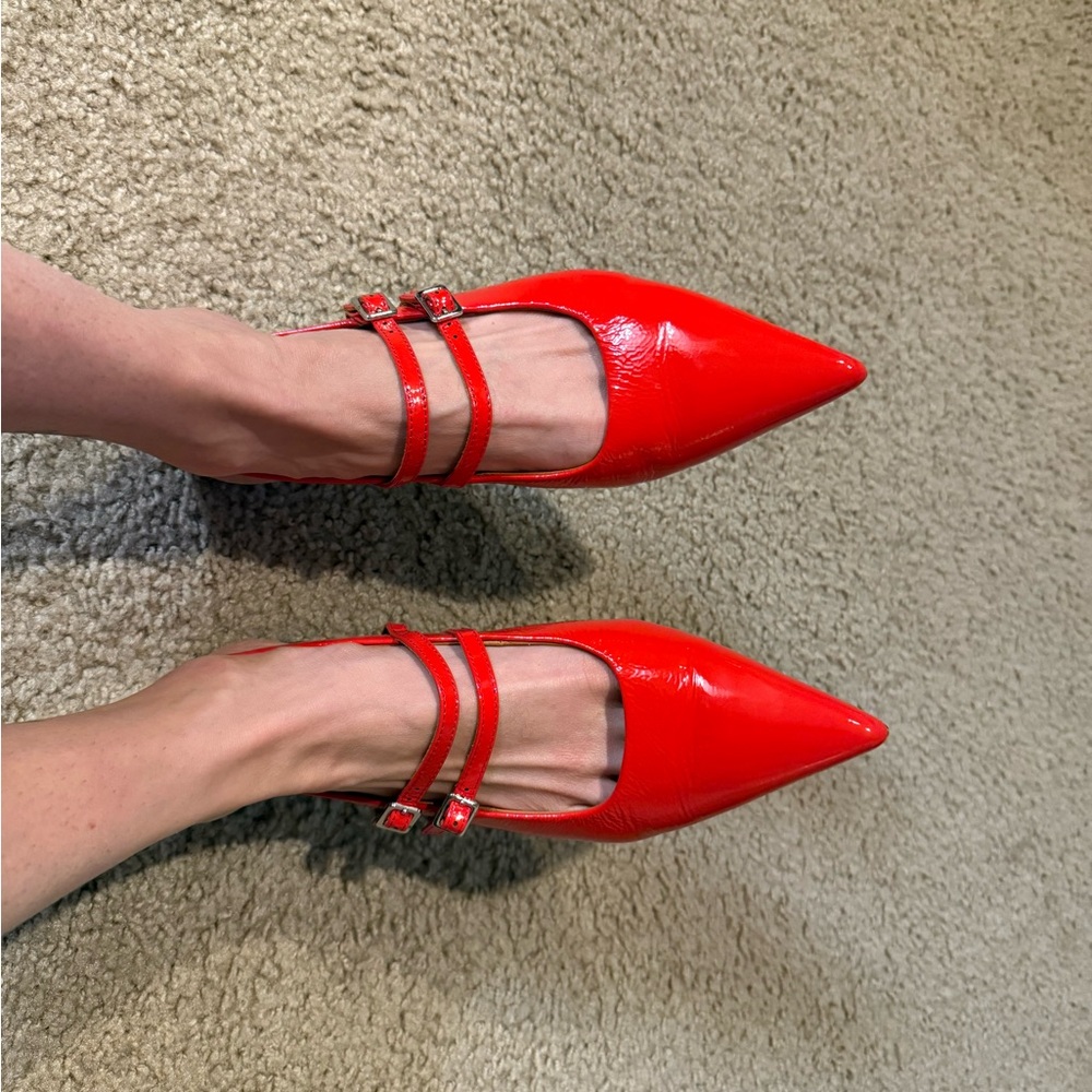 Vanguard double strap patent leather mules.